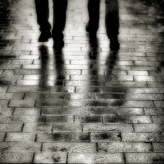 feet on wet paving stones